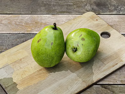 Fresh Green Pears Placed On Wooden Cutting Board Over Rustic Table Surface 3d model