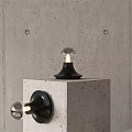 Modern Wall Lamps With Black Base And Clear Glass Shade On Concrete Wall