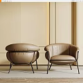 Brown Leather Armchairs Modern Design With Black Metal Legs Against Light Colored Wall