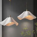 Modern Pendant Lights Hanging With White Wavy Shades Gold Fixtures Gray Wall And Green Plant