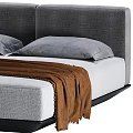 Modern Double Bed With Upholstered Headboard Gray Pillows And Brown Throw Blanket