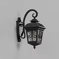 Ornate Black Vintage Wall Sconce With Illuminated Glass Shade Mounted On White Wall