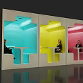 Colorful Modern Work Pods With Seated People And Tables In Blue Yellow Pink