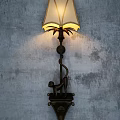 Vintage Wall Lamp With Monkey Sculpture Base And Linen Shade Illuminating Gray Textured Wall