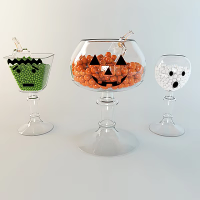 Three Decorative Glass Cups With Green Peas Orange Pumpkin Candies And White Ghost Balls 3d model