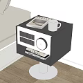 Modern Black White Bedside Table With Silver Mug Notebook Radio Books on Metal Stand