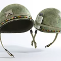 Two Old Green Helmets With Colorful Decorative Straps And Small Bottle