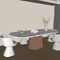 Modern Table and Chairs Set Featuring Round Marble Top and Vase with Fruit Bowl