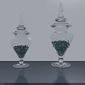 Transparent Ceramic Vessels With Lids Containing Green Granules On Smooth Surface