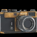Nikon Vintage Style Digital Camera With Black And Gold Design And Classic Lens