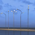 Modern Outdoor Lights with Curved Metal Poles and Water Reflection Under Cloudy Night Sky