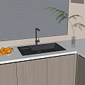 Modern Kitchen Countertop With Gray Sink Faucet Glass Bowl Of Oranges And Wooden Cabinets