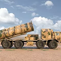 Camouflage Multi Wheeled Military Functional Vehicle With Missile Launchers On Desert Terrain