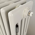 White Column Radiator With Metal Valves And Base For Home Heating Interior