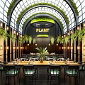 Plant Themed Restaurant Interior With Arched Glass Ceiling Green Plants And Dining Tables