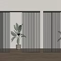 Black Vertical Sliding Doors in Interior with Wooden Floor and Green Plants