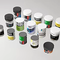Various Colored Paint Cans With Different Brand Labels On White Background