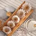 Home Living Essentials With Wooden Tray Sunflowers Pebbles Wicker Balls And Cream Jar
