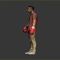 Man Wearing Red T Shirt Beige Pants With Red Boxing Gloves Standing On Grey Background