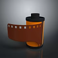 Vintage Household Film Reel With Black Lid Orange Body And Unfolded Brown Film Strip