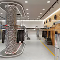 Modern Clothing Store Interior With Hanging Racks Central Display And Fashion Apparel