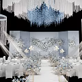 Elegant Wedding Venue Decoration With White Tables Floral Arrangements And Crystal Chandeliers