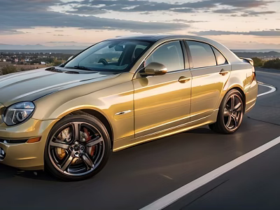 Golden Sedan Driving On Open Road With Scenic Sunset Sky Background 3d model