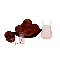 Pomegranate Juice in Glass Pitcher with Fresh Whole Sliced Pomegranates and Seeds