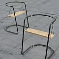 Modern Leisure Chairs with Black Metal Curved Frame and Wooden Seat in Stylish Design