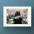 White Framed Landscape Painting With Snow Capped Peaks And Cloudy Sky