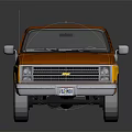 Red And Yellow Chevrolet Pickup Truck Model On Black Reflective Surface