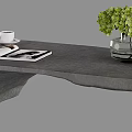Modern Gray Coffee Table With Open Magazine Coffee Cup And Green Flowers In Vase