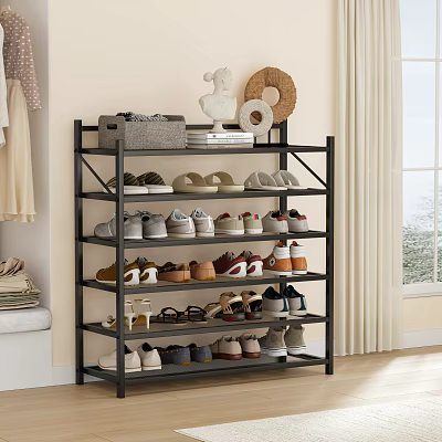 Black Multi Tiered Shoe Rack Organizing Various Shoes Home With Decorative Items On Top 3d model