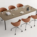 Wooden Conference Table With Orange Rolling Chairs Laptops Printer Coffee Cups And Documents