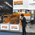 BARTEC Safe Technologies Exhibition Booth With Technical Equipment And People Interacting 3d model