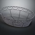 Decorative Metal Wire Storage Basket With Curved Scroll Design And Oval Shape