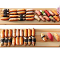 Assorted Sushi Platter With Different Rolls On Wooden Plates And Cherry Blossoms