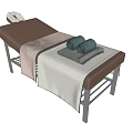 Comfortable Modern Massage Bed With Brown Beige Mattress Metal Frame And Folded Towels