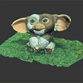 Cute Brown And White Furred Creature Figurine With Big Ears Sitting On Green Leaf