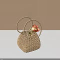 Light Brown Woven Rattan Basket With Loop Handles And Orange Flower