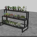 Black Multi tiered Flower Stand With Wheels Holding Various Potted Plants
