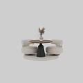 Stylish Round Wooden Table Set with Beige Padded Chairs and White Vase Decor
