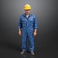A Man in Blue Work Uniform Wearing Yellow Hard Hat Standing Against Dark Background