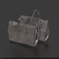 Two Gray Minimalist Handbags With Leather Handles And Sleek Design On Blue Background