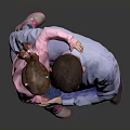 Happy Child in Pink Top Being Held by Father in Blue Shirt Against Gray Background