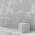Modern Gray Cubic Structure With Rough Surface Against Textured Concrete Wall