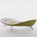 Modern Curved Light Green Sofa With Sleek Lines and Floor Lamp in Minimalist Interior