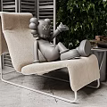 Modern Beige Chaise Lounge With Gray Sculpture Green Leafy Wall And Side Table