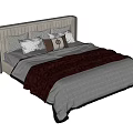 Modern Double Bed With Upholstered Headboard Multiple Pillows White Bedspread And Red Blanket