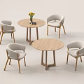 Modern Leisure Chairs With Light Cushions And Round Wooden Tables For Relaxation